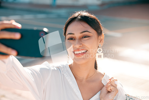 Image of Phone, selfie and shopping with a woman customer taking a photograph while in the city for retail or consumerism. Mobile, technology and consumer with a young female outdoor to shop, buy or purchase