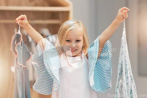 Image of Girl child, choice or change clothes in fashion brand retail store shopping sale happy for buying decision at mall. Smile, happiness and excited young kid customer choose designer clothing dress shop