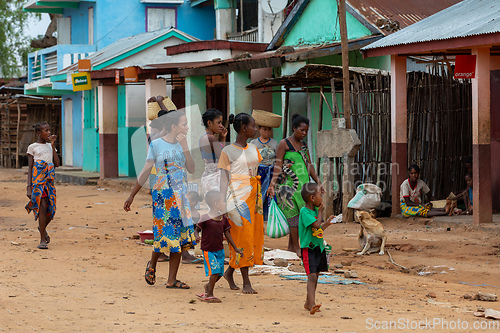 Image of Malagasy woman's with children walking down the street. Bekopaka, Madagascar