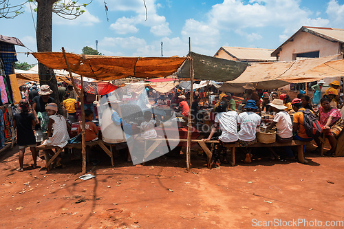 Image of Street market in Mandoto city, with vendors and ordinary people shopping and socializing. This image portrays the local fast food in street marketplace.