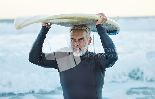 Image of Senior man, ocean surfer and carrying surfboard on holiday, vacation or summer trip in Canada. Workout, fitness and retired male with board after surfing, water sports and training exercise by sea.