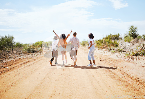 Image of Freedom, desert and friends walking outdoor in nature on a road trip vacation in the countryside. Travel, happy and group of people on outside dirt road adventure together on a holiday in Australia.