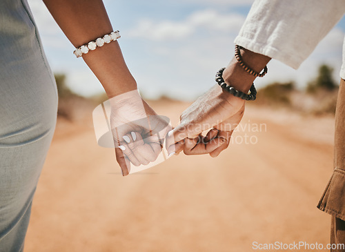 Image of Couple walking, promise and hook fingers for support, trust and love in nature outdoors. Closeup man, woman and connect pinky hands in hope, respect and commitment link of save the date relationship