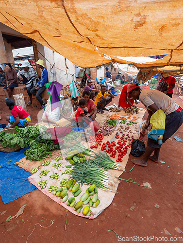 Image of Street market in Mandoto city, with vendors and ordinary people shopping and socializing. This image portrays the local lifestyle and economy of Madagascar.