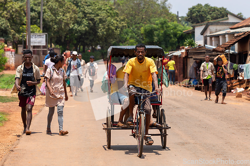 Image of Traditional rickshaw on the Mandoto city streets. Rickshaws are a common mode of transport in Madagascar.