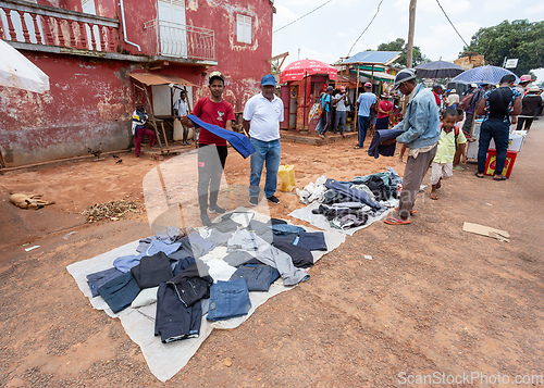 Image of Street market in Mandoto city, with vendors and ordinary people shopping and socializing. This image portrays the local lifestyle and economy of Madagascar.