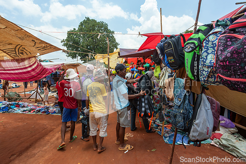 Image of Street market in Mandoto city, with vendors and ordinary people shopping and socializing. This image portrays the local lifestyle and economy of Madagascar.