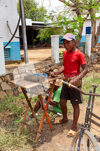 Image of Street vendors selling Koba, a traditional Malagasy sweet