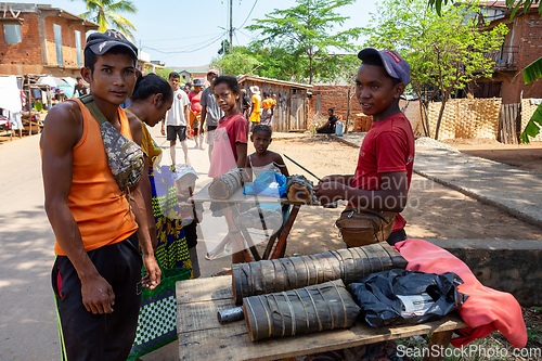 Image of Street vendors selling "koba," a traditional Malagasy sweet