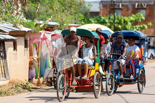 Image of Traditional rickshaw on the city streets. Rickshaws are a common mode of transport in Madagascar.