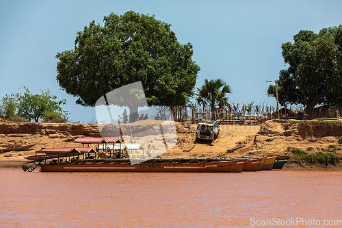 Image of Ferry carrying passengers travels on the Tsiribihina River in Madagascar.