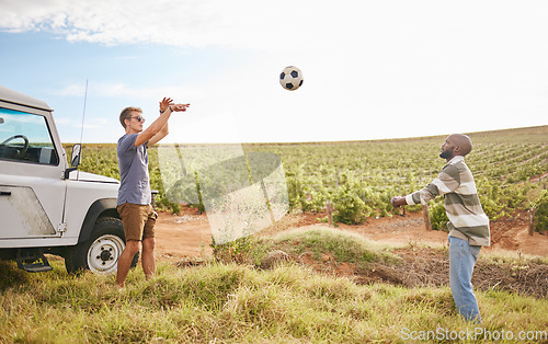 Image of Nature. soccer and men throw a football on a road trip travel break in the countryside. Exercise and fitness of people outdoor during a trip adventure playing sports on green grass in summer