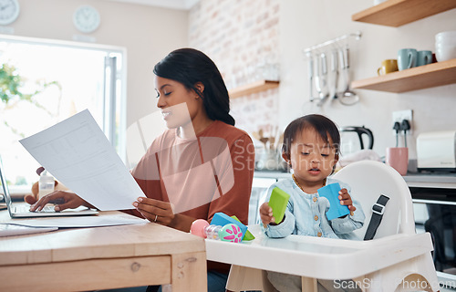 Image of Mother, baby and laptop in kitchen, freelance and paying bills while bonding with down syndrome child. Disability, kids and multitasking parent productive freelancer in home, motherhood work balance