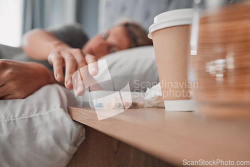 Image of Depression pills, insomnia medicine and woman sleeping in bed for pharmaceutical, psychology or mental health awareness. Depressed, addiction and sick or sad person and drugs help or risk in bedroom