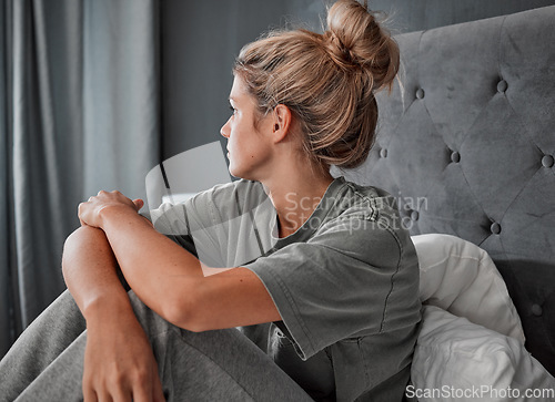 Image of Depression, thinking and sad girl on bed alone and mental health mindset with anxiety problem in home. Young woman in mental isolation from fear, worry and stress about thoughts or idea in mind