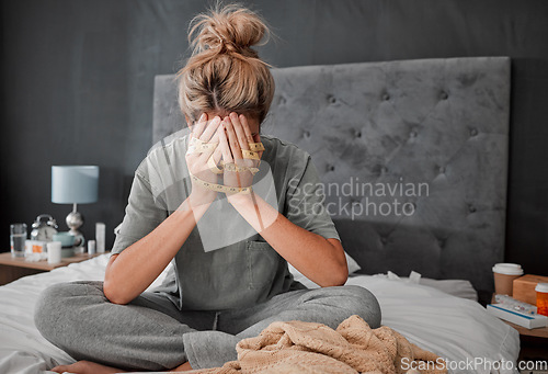 Image of Hands, anorexia and depression with a woman on her bed holding a tape measure and looking sad or frustrated. Mental health, bulimia and eating disorder with a young female in her bedroom at home