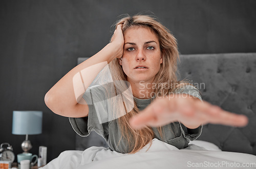 Image of Woman, stress and insomnia in house bedroom, home or hotel with mental health, anxiety and depression. Portrait, hangover and headache for person with a sleeping problem, pills addiction and burnout