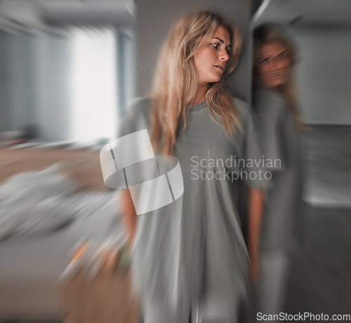 Image of Bipolar, depression and scared young woman in a bedroom with worry, fear and stress. Insomnia, mental health problem and patient in pain with blur motion, anxiety and schizophrenia at mental hospital