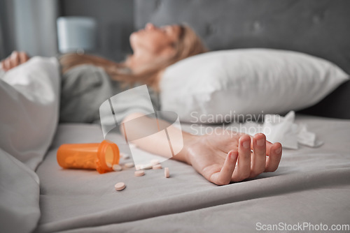 Image of Depression, mental health and overdose with pills and woman in bedroom for anxiety, suicide and death. Sad, medicine and grief with girl lying in bed after taking drugs for pain, trauma and problem