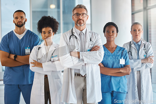 Image of Doctors, nurses and team portrait in hospital, clinic or medical office. Diversity, health and healthcare professionals standing together arms crossed in confidence teamwork, collaboration or support