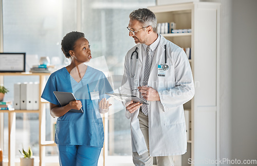 Image of Hospital doctor and student nurse communication in office for information on patient record. Professional expert and healthcare man in conversation with nursing worker on medical diagnosis.