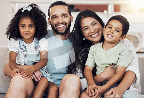 Image of Happy, smile and portrait of a family bonding and relaxing together at home in puerto rico. Happiness, love and parents resting and holding their children with care at their comfortable house.