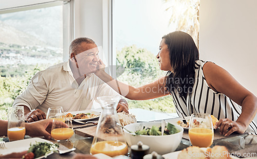 Image of Senior couple, love bonding or food in house, home or restaurant in thanksgiving, marriage anniversary or celebration event. Smile, happy or retirement elderly man and Mexican woman with festive meal