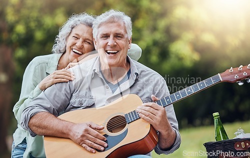 Image of Couple, guitar and picnic with a senior man and woman in nature with a smile and music for fun. Happy, retirement and love with an elderly male and female pensioner in a park with an instrument