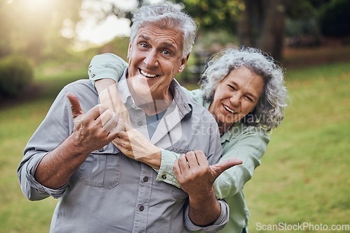 Image of Park, wellness and senior couple with thumbs up for healthy motivation or support in retirement with green park lens flare. Elderly people with love, care and happy with health lifestyle portrait