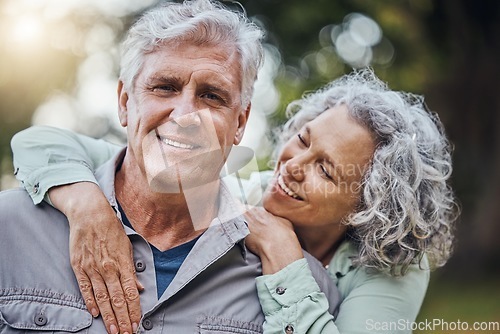 Image of Senior hug, couple and marriage love in nature with a happy smile of people. Happiness of a elderly woman and man portrait together enjoying retirement, romance and quality time smiling outdoor