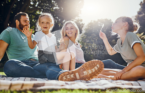 Image of Happy family, picnic and summer, fun in park with children and parents bonding and playing on grass. Relax, nature and excited kids enjoying freedom and fun activity with cheerful mother and father