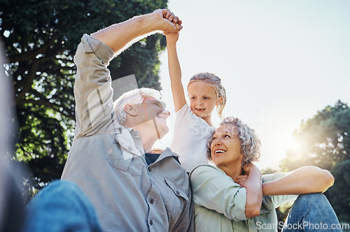 Image of Grandparents playing together with a girl in the park in the morning. Family, love and grandchild bonding with grandmother and grandmother in a garden. Child holding hands with senior couple outside