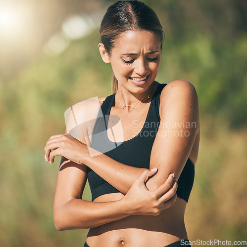 Image of Fitness, woman and elbow in pain, injury or sports accident of runner suffering in joint ache outdoors. Athletic female holding painful area of muscle, inflammation or broken bone in discomfort