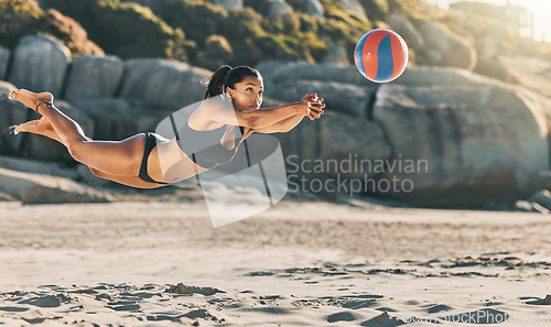 Image of Volleyball, sports game and woman on the beach in a bikini while on holiday in Mexico in summer. Jump for African girl on vacation by ocean and playing in sport competition with energy during travel