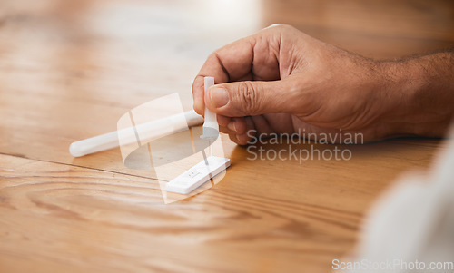 Image of Hands, covid antigen test or dropper in home kit, house or living room for healthcare insurance or medical virus disease. Zoom, man or pcr covid 19 check for patient in isolation lockdown compliance