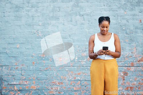 Image of Black woman, fashion and phone by mock up wall in Nigerian city for marketing, advertising or sales deal promotion mockup. Smile, happy or trend student with mobile technology for social media search