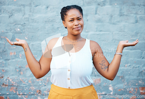 Image of Portrait of confused black woman in doubt with a question and unsure gesture with arms up. Asking why, confusion and clueless girl with hands raised standing by a wall outside in urban town or city