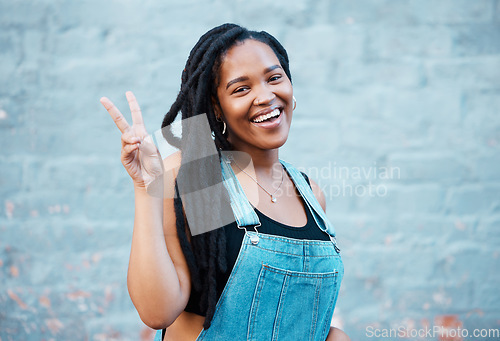 Image of Black woman, peace sign or fashion on city building wall, mockup space or mock up in style, trend or cool clothes in Atlanta. Portrait, happy smile or student model with fun, cool or playful gesture