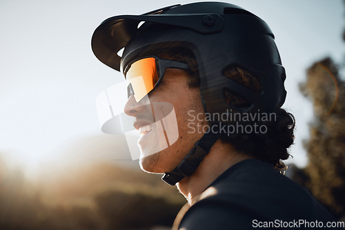 Image of Safety, gear and motorcycle man with helmet and sunglasses in nature forest for outdoor adventure, travel or training with sky sunshine mockup. Healthy sports biking person in the woods for exercise