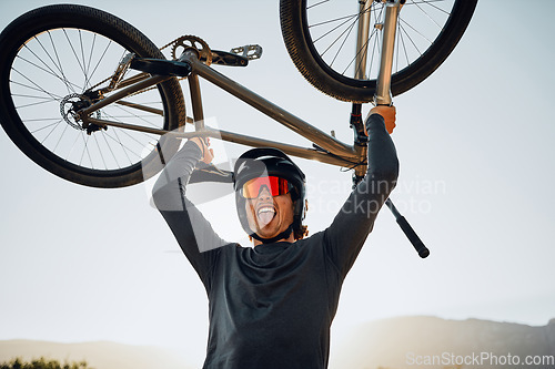 Image of Mountain bike, sports man and winner celebrate success, fitness goal or winning outdoor competition blue sky mockup. Motorcycle person lift bicycle for achievement, motivation or target celebration