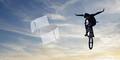 Image of Mountain bike man, sky jump and energy of action, freedom and competition silhouette, shadow and mockup. Professional cycling athlete in air, danger performance and bicycle risk on background clouds