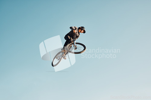 Image of Motorcycle stunt, man cycling in air jump on blue sky mock up for sports action performance, fitness training or outdoor bike performance. Professional sports person with bmx bicycle adventure mockup