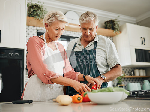 Image of Elderly, couple and kitchen for cooking with vegetables for dinner with nutrition food. Man, woman and in retirement learning to cook for healthy diet in home together, love and vegan meal in house