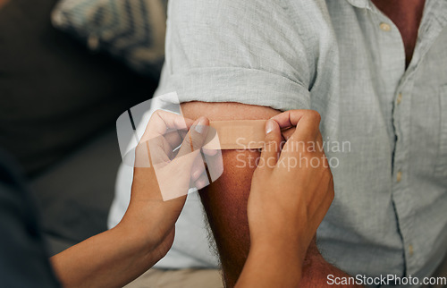 Image of Covid, vaccine and plaster with hands of a doctor sticking a bandaid on a patient in the hospital or clinic. Healthcare, medicine and trust with a female nurse consulting with a man for health