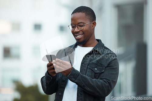Image of Black man, phone and smile in city reading email, social media or blog on internet. Man, glasses and smartphone outside in Chicago happy with communication on mobile app via 5G web while outdoors