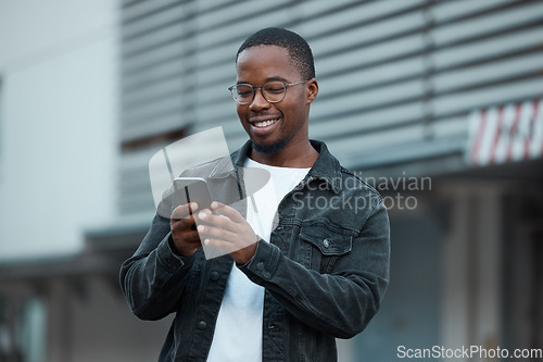 Image of Black man, phone and social media in city reading text message or communication on social network app. African American person, chat conversation and happy on 5g mobile smartphone in Atlanta smile