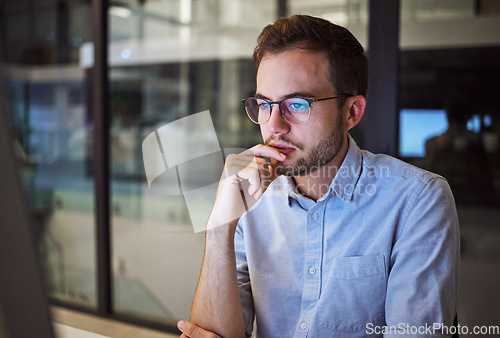 Image of Accountant man, night and thinking at computer in office for strategy plan with business expenses. Expert corporate finance employee in workplace late with focus and concentration to finish work.