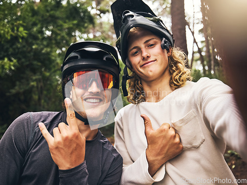 Image of Friends in forest, cool fitness selfie fitness with cycling helmet and smile with hands gesture in Australia. Workout on bicycle trail, fun travel adventure and outdoor sports training in green woods