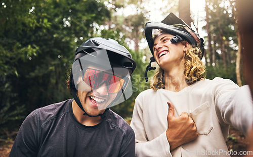 Image of Friends, cycling men and selfie in forest, park or woods cyclist trail in nature. Thumbs up, fitness and cyclists, bikers or bike rider smile in mountain biking helmets in park outdoor bicycle ride.