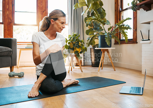 Image of Yoga, zen and senior woman on laptop streaming training video, web yoga class or tutorial at home. Health, exercise and elderly female on tech pc, pilates mat and stretching, fitness and wellness.